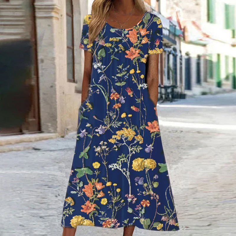 Pomi | Zomerjurk met bloemenprint voor dames – Midi-jurk met losse pasvorm die de buik bedekt