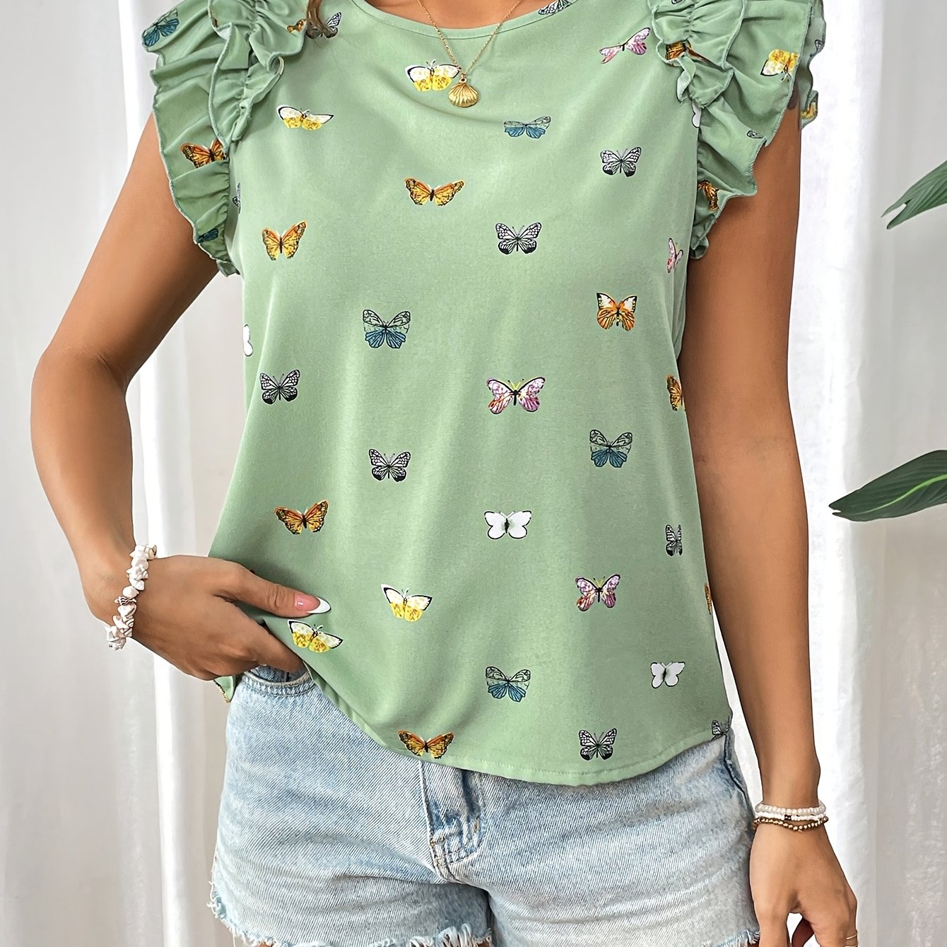 Islyn | Vakantietop voor dames – Elegante blouse met vlinderprint en ruches aan de mouwen